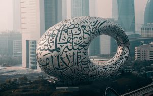 globe with arabic and english text overlay, digital bridge concept