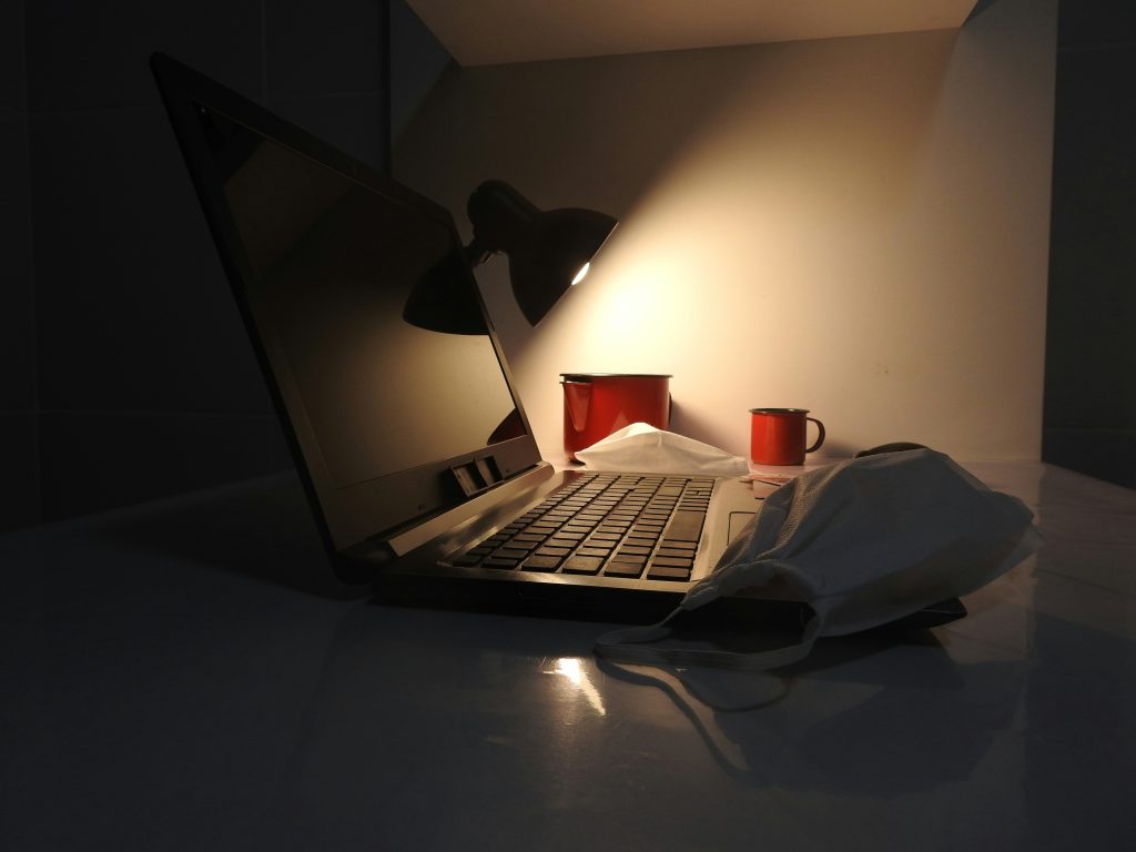 freelancer empty inbox laptop worried coffee desk