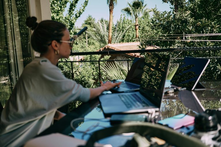 freelancer multiple monitors income sources digital nomad laptop