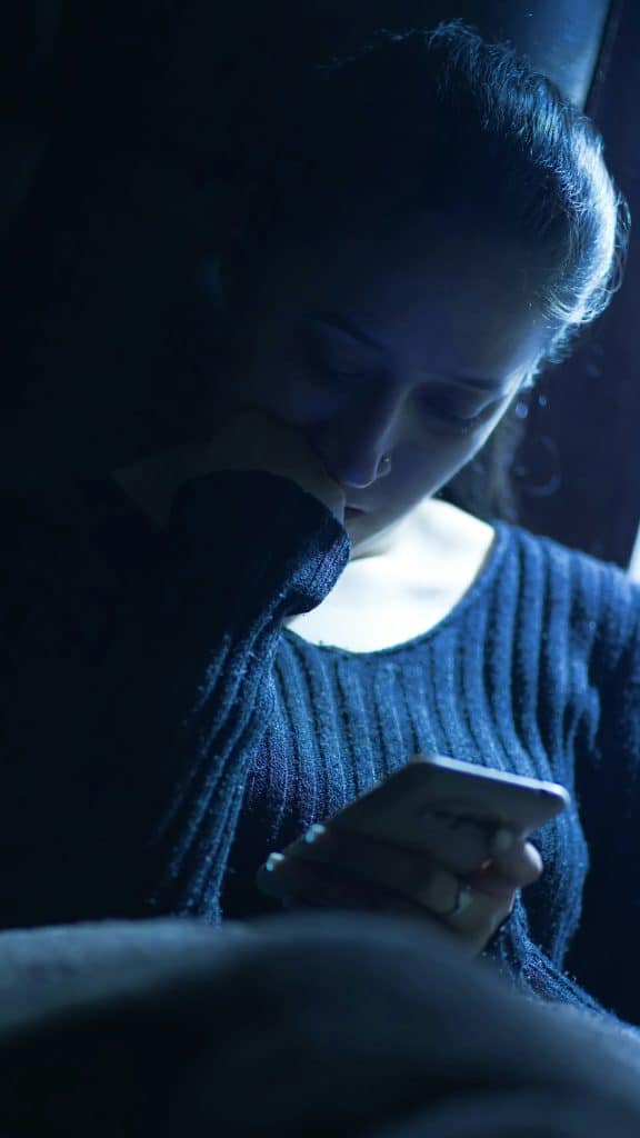 lonely person blue light screen night digital. 1
