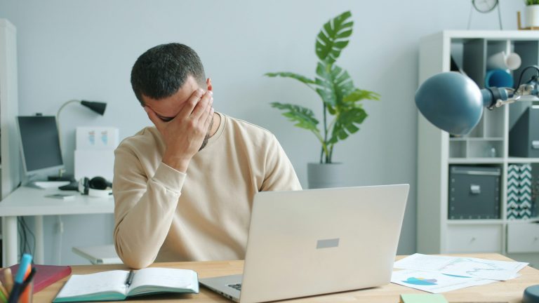 unexpected bill shock tax document freelancer worried desk