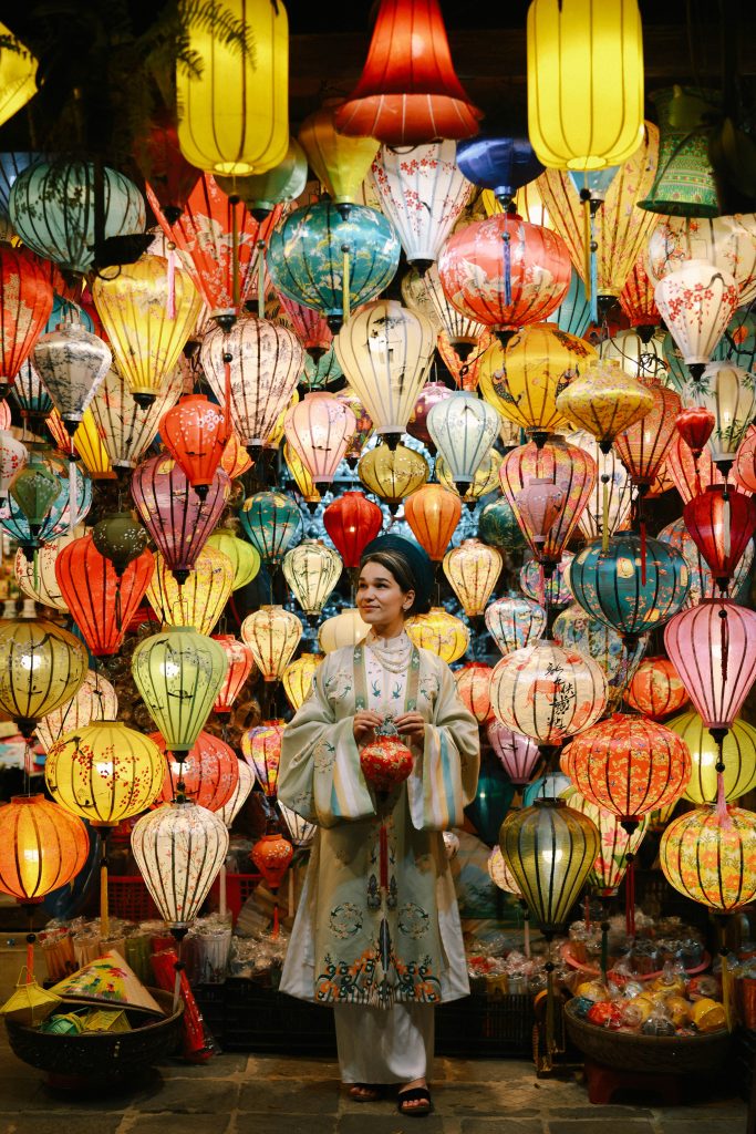 woman solo traveler smiling at old city market