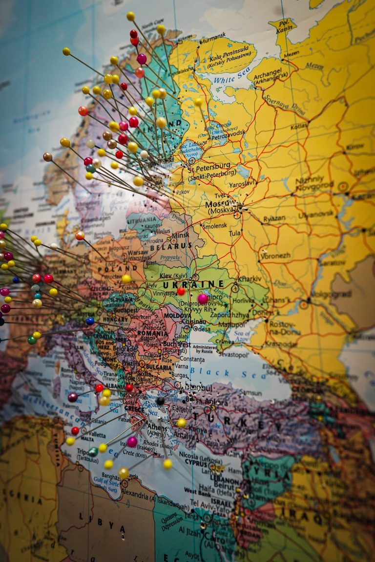 world map with pins on travel destinations