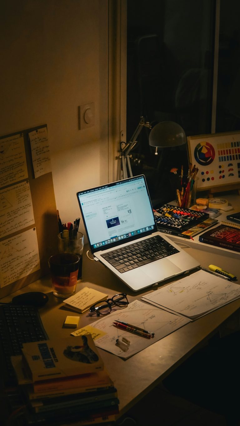 organized research workspace notebook laptop focus