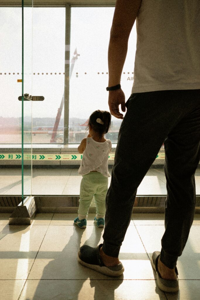 airport goodbye family embrace
