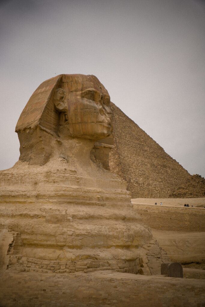 The Sphinx, with a pyramid behind it, Egypt, Pharaonic civilization