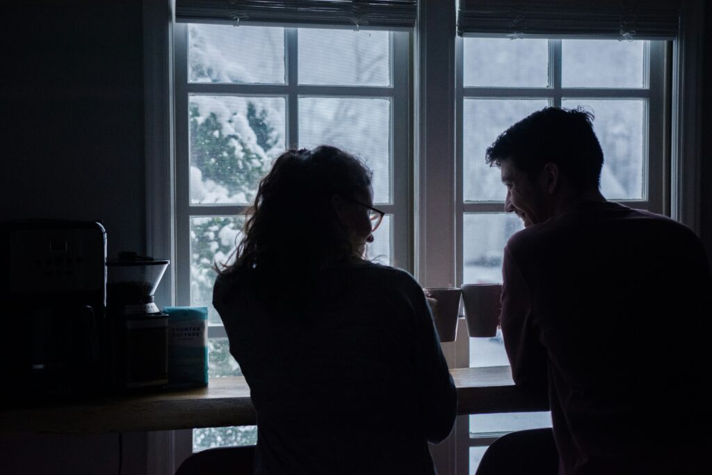 couple sitting together quiet coffee morning