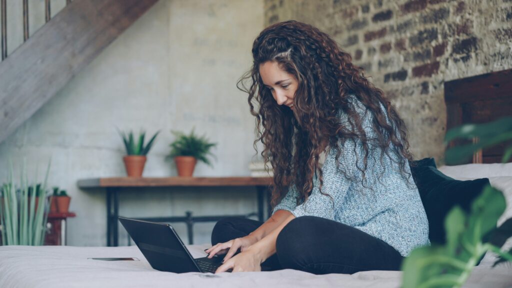 girl using laptop at home