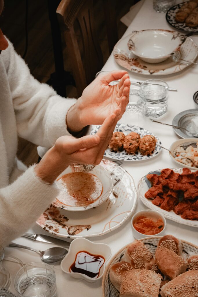 Hands thanking their Lord for the food