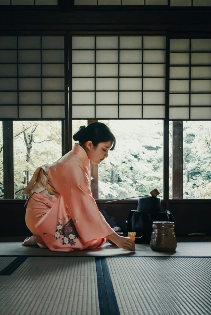 Woman in kimono preparing tea