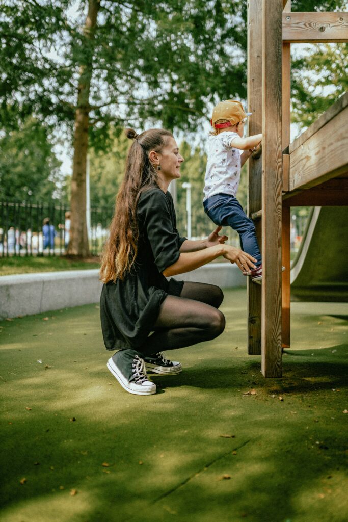 parent child playground watching close