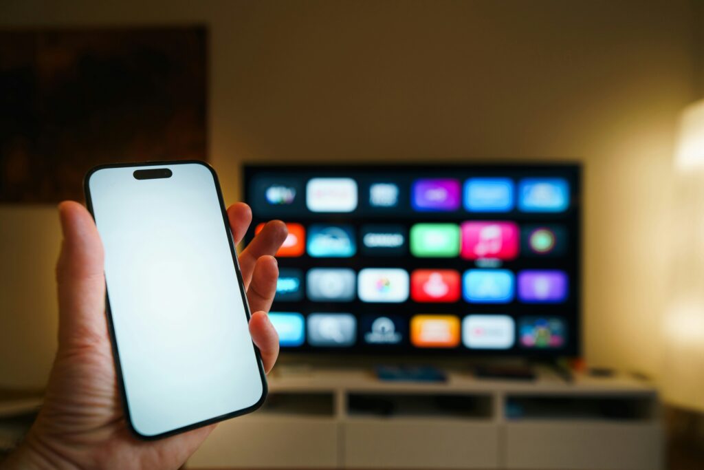 person watching smart tv cozy living room night