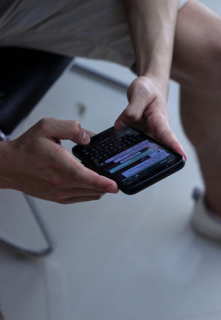 phone screen hands typing message