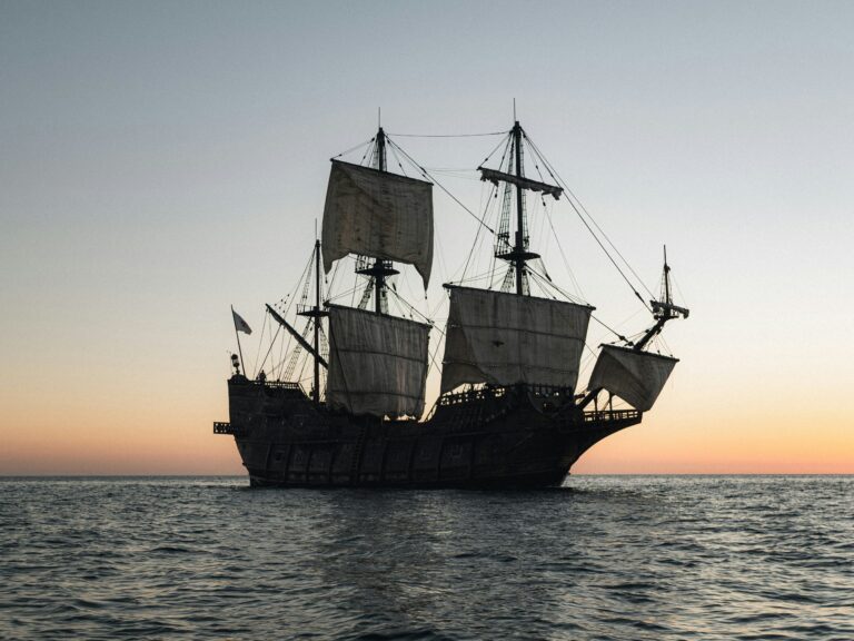 pirate ship silhouette ocean dramatic