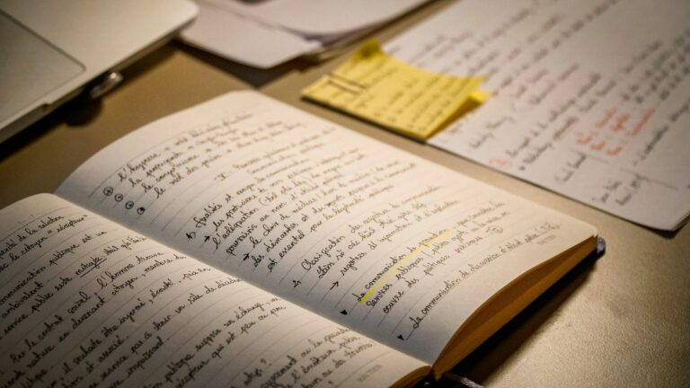 open philosophy book desk notes handwritten