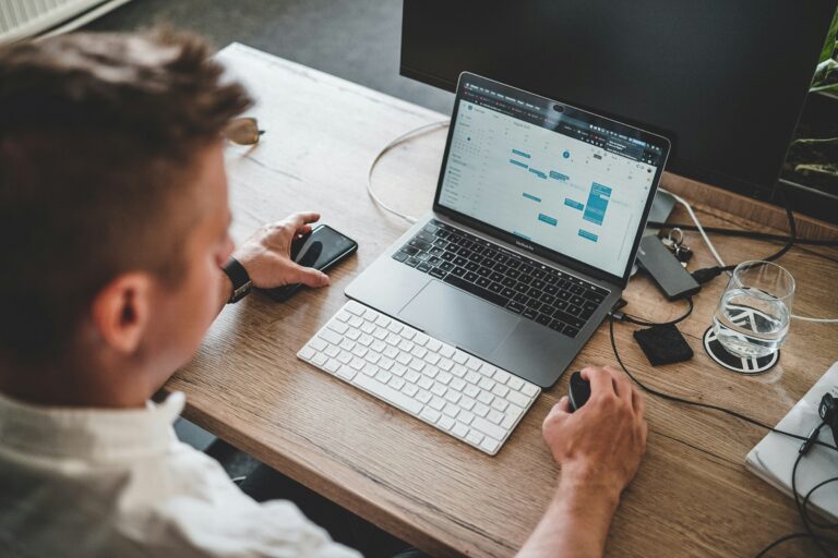 person at computer with automation icons