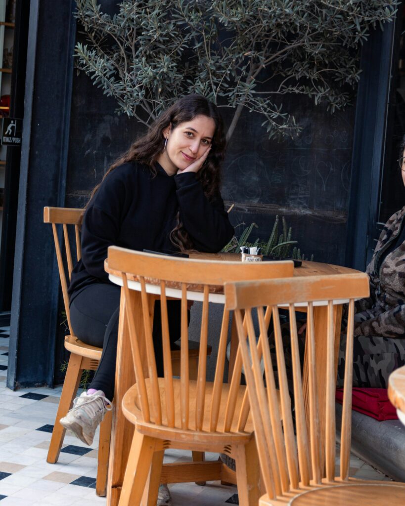 young Turkish woman-smiling-in-cafe