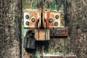 old key lock wooden door close up